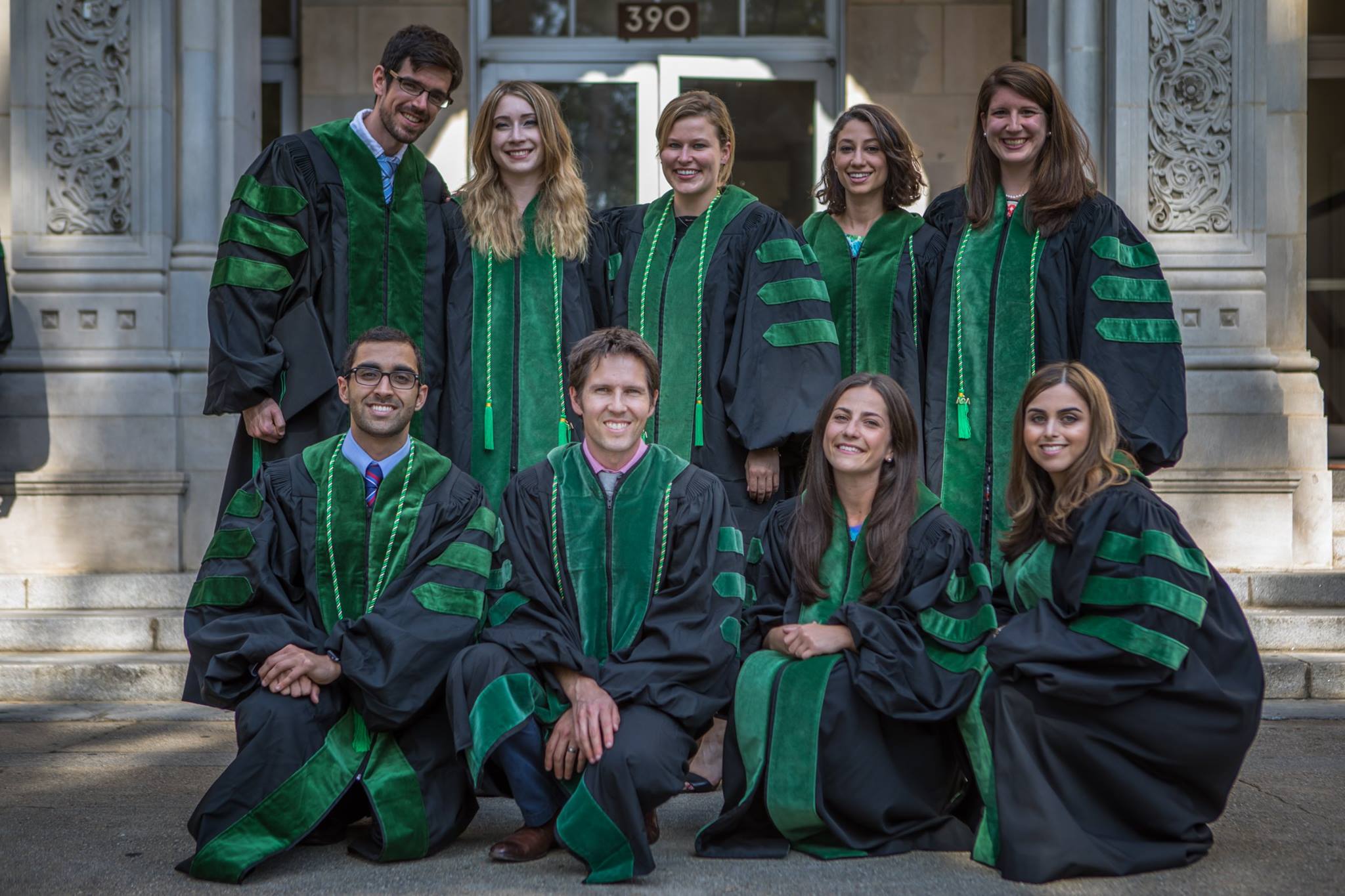 The first cohort of the David Geffen Medical Scholarships at graduation, pictured here in their green and black regalia. 