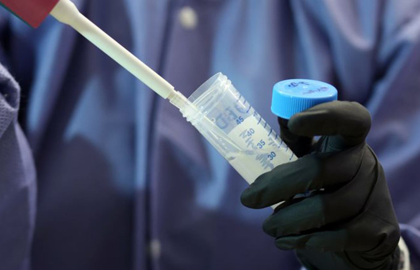 Researcher handling a sample