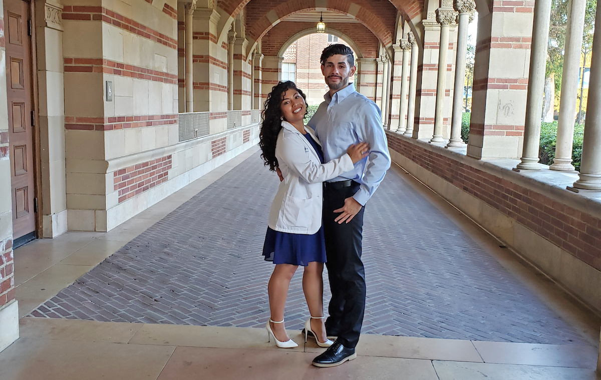 Rocio Garcia Quinteros poses with her husband after her White Coat Ceremony