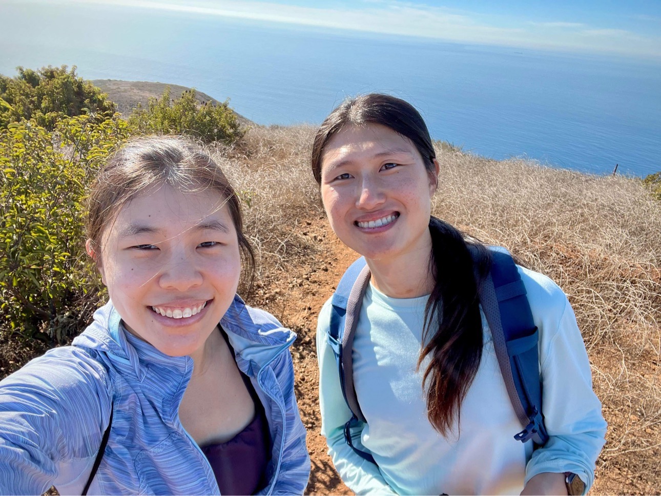 Xin Qi and a friend on a hike