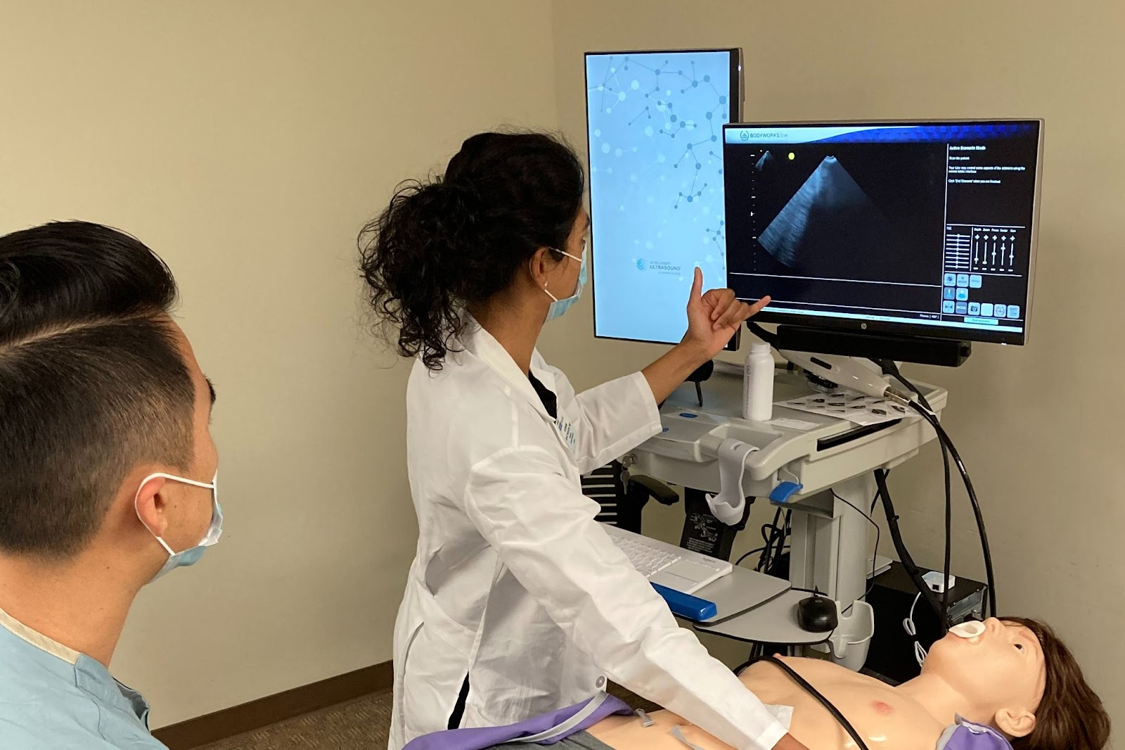Medical school students reviewing ultrasound images