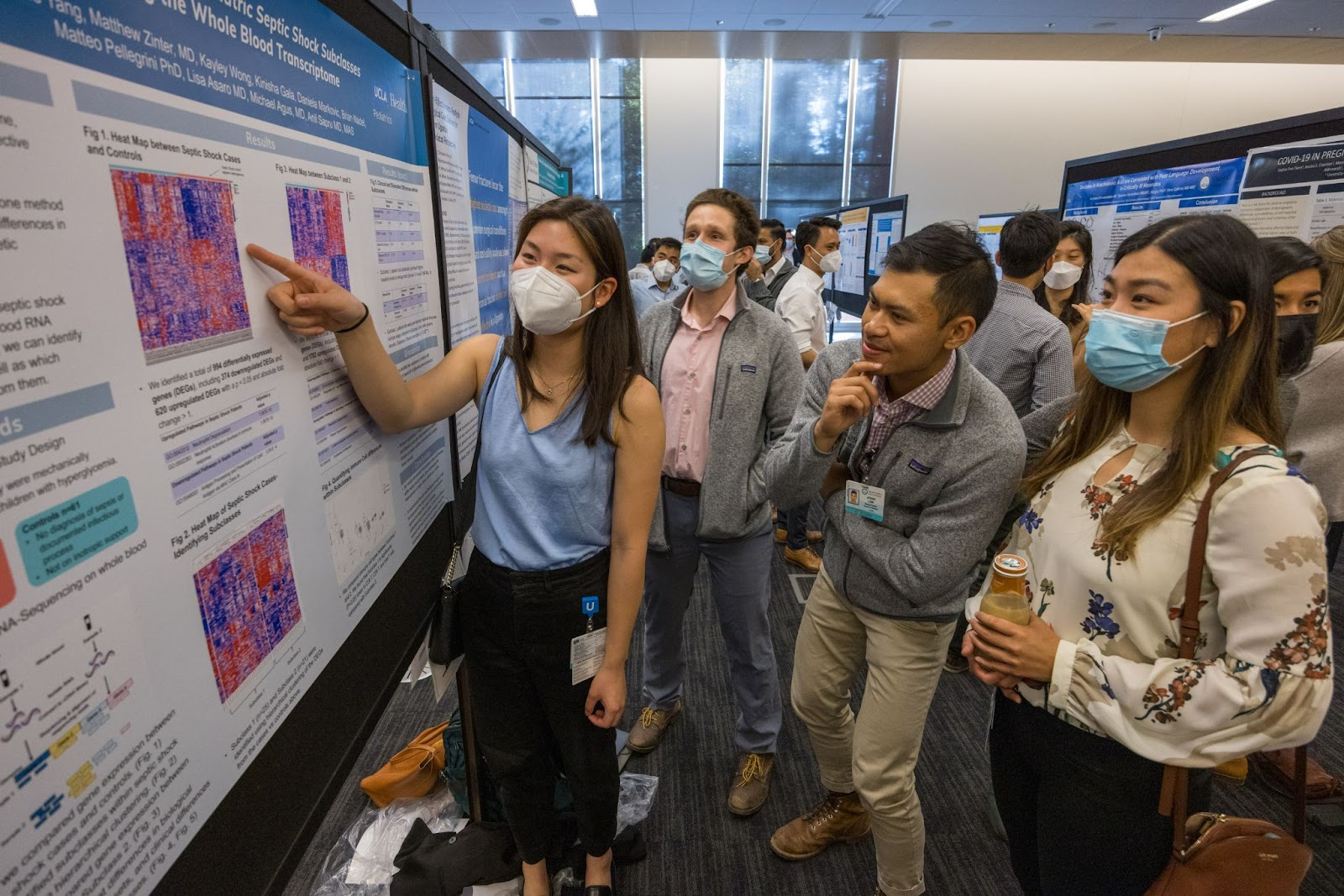 Medical school students at a research poster presentation