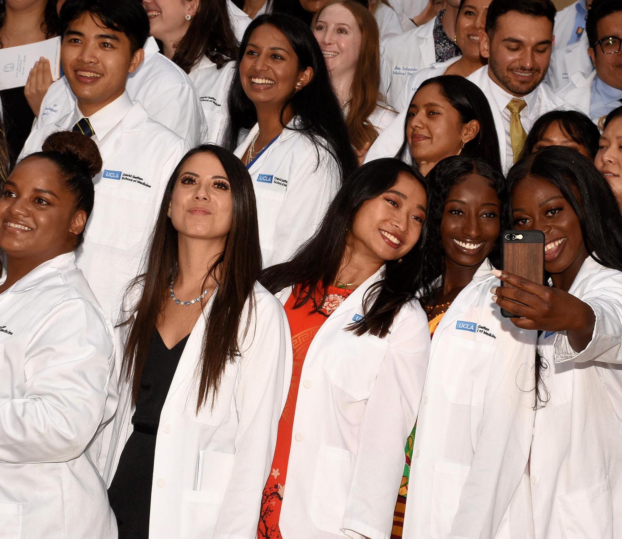 Students taking selfies at the 2022 White Coat Ceremony