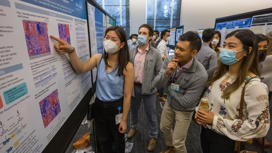 Medical school students at a research poster presentation