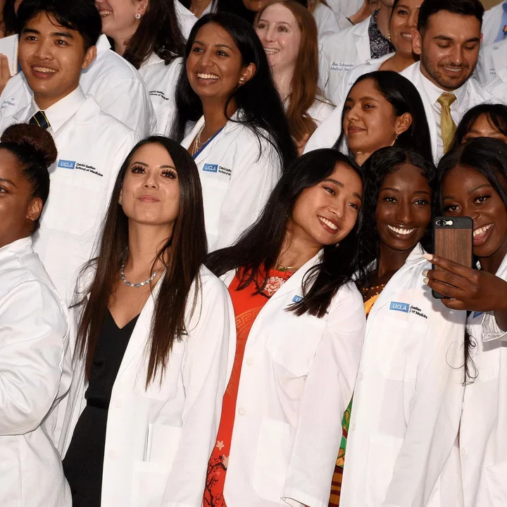 Students taking selfies at the 2022 White Coat Ceremony