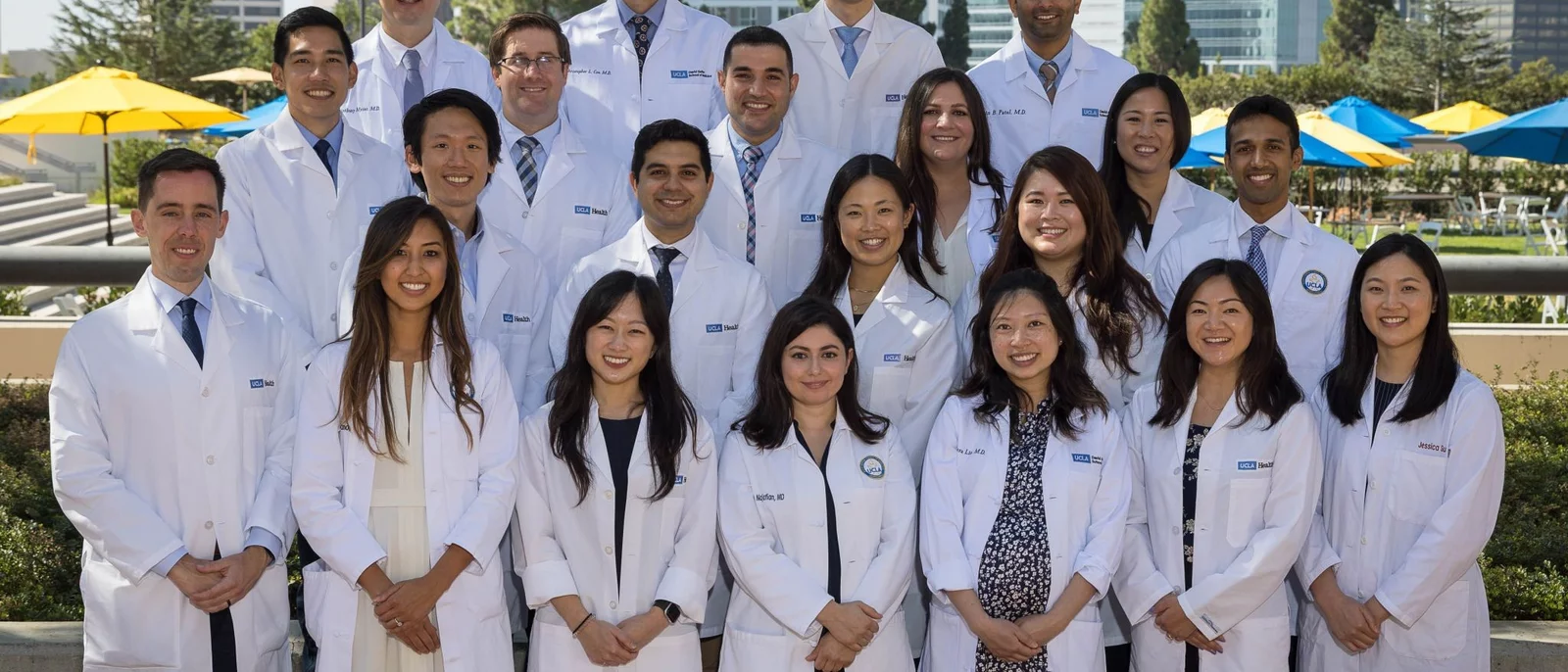 medical students in white coats on switzer plaza