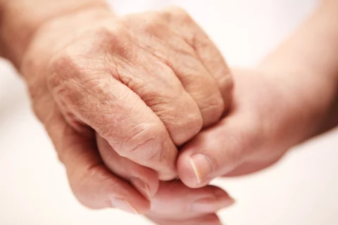 Alzheimer's and Dementia Young Adult Children Caregiver Support Group Elderly Person and Caregiver Holding Hands