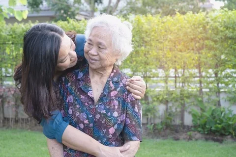 General Alzheimer's and Dementia Caregiver Support Group Granddaughter Hugging Grandmother