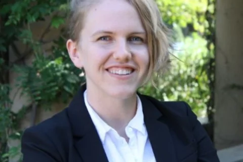 Smiling woman dressed with suit jacket