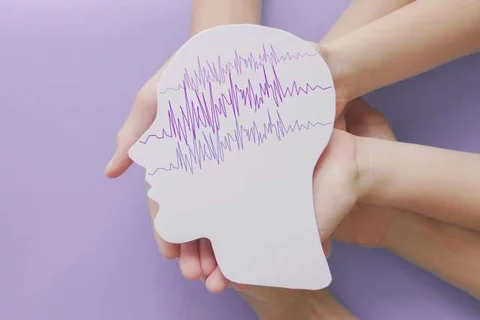 Different Types of Epilepsy Hands Holding Drawing of Human Head and Seizure Activity