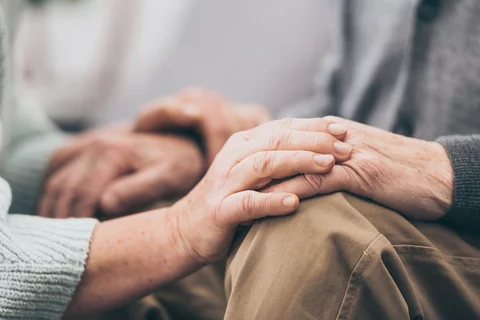 A couple holding hands - image for LBD Caregiver Support Group