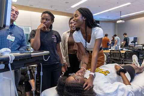 Students try techniques during POCUS week in the learning studio