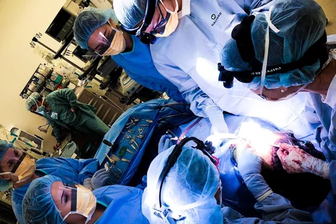Dr. Justine Lee (far right) and colleagues performing gender-affirming facial feminization surgery at UCLA