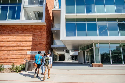 Medical school students walking into Geffen Hall