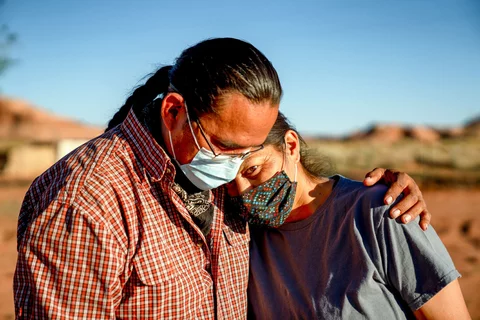 Native American individuals embracing