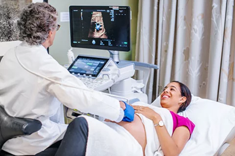 Obstetricians vs Gynecologists What's the Difference? Pregnant woman receiving ultrasound