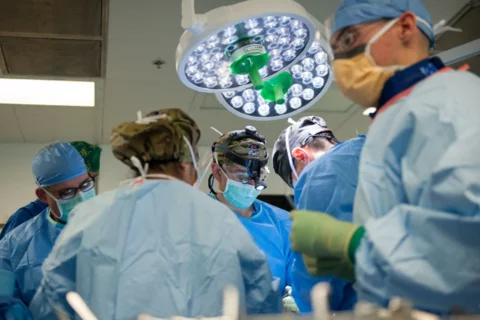 Trauma Surgeons vs ER Doctors View of Busy Operating Room