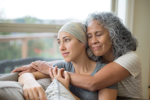 Types Of Oncology Specialists Mother Hugging Daughter Undergoing Chemotherapy