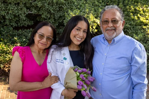 Urania Argueta with her parents