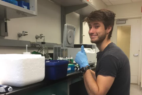 Medical student Eric Smith, pictured working in a lab, shares his story of becoming a doctor 