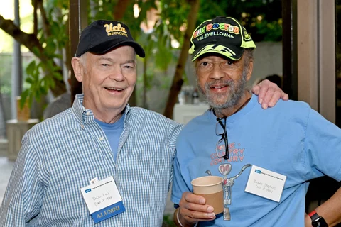 two men posing together
