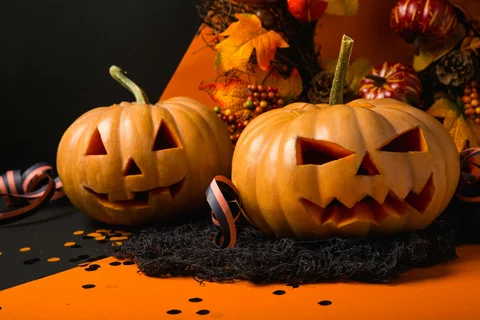 carved jack-o-lanterns and fall decorations