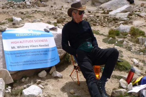 A researcher waiting for participants to join a study on high altitude sickness