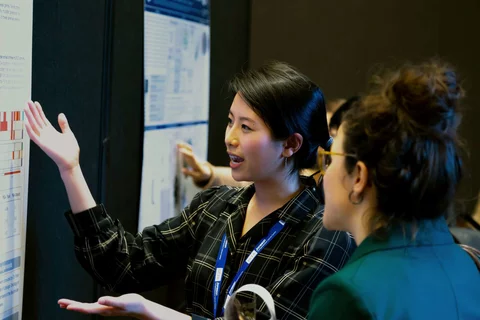 young-female-researcher-poster-session-retreat