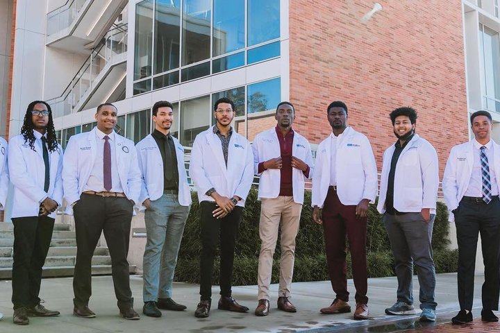 Becoming a Doctor: Tristan Paul Bennett posing with his classmates
