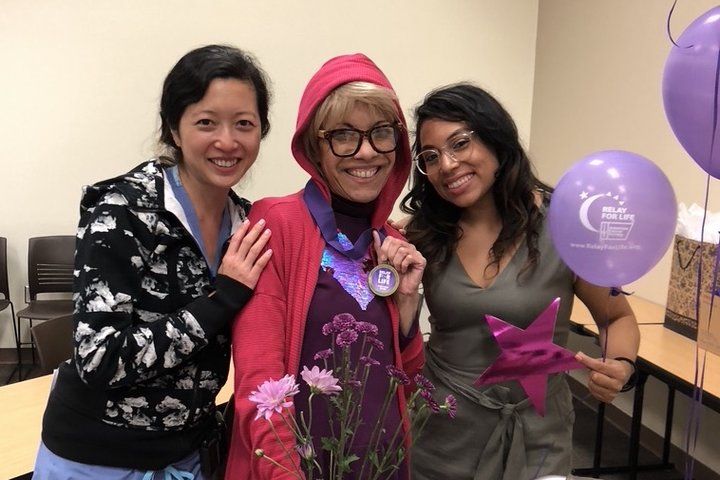 Dr. Tiffany Lai, who treats HPV and Cervical Cancer, posing with patients