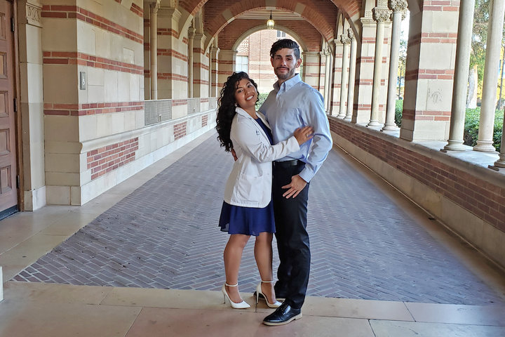 Rocio Garcia Quinteros poses with her husband after her White Coat Ceremony