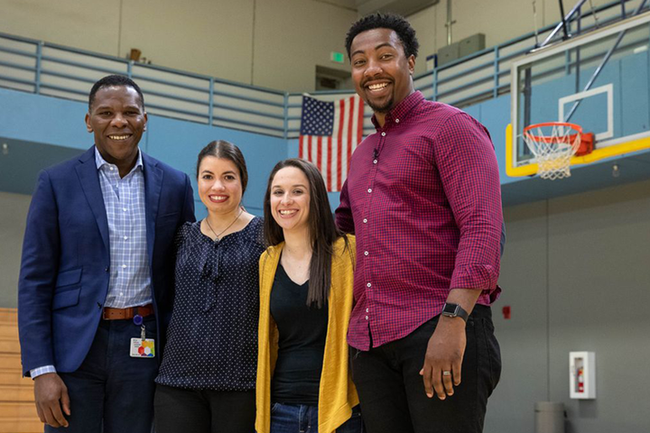 Dr. Olujimi Ajijola, left, with Edward Jean-Louis and Christine Frye and Emily Duncan, who performed CPR on Jean-Louis after he collapsed on the basketball court in 2016.