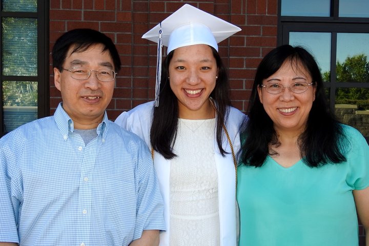 Medical student Yifan Mao with her parents at her college graduation