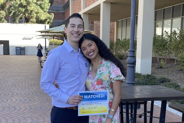 UCLA residents and med-school alumni Makana Williams and Rigoberto Perez Hernandez posing together after Match Day.