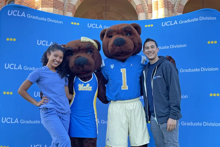 Rigoberto Perez Hernandez, pictured here with fellow UCLA resident and the Bruin mascots, shares his story of becoming a doctor