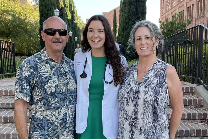 Medical student Shannon Richardson, pictured here wearing her white coat and posing with her parents, shares her story of becoming a doctor.