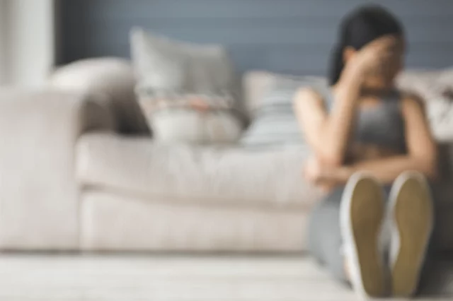 Disordered Eating Misconceptions Woman Sitting on Floor Feeling Shame