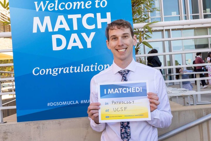 Medical student Samuel Hulbert pictured with his residency match results
