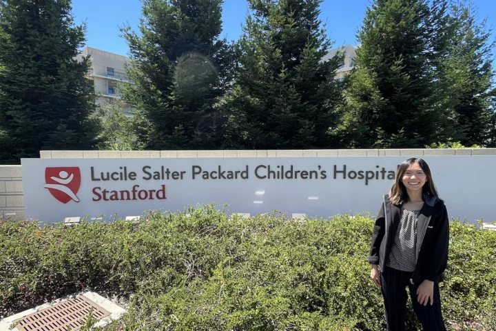 Molecular, Cellular, and Integrative Physiology (MCIP) PhD program student Rochelle Lai, pictured in front of Stanford Children’s