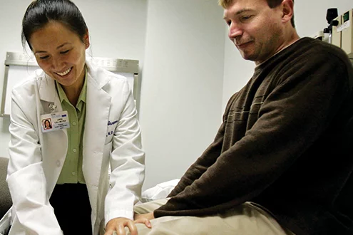 Linda Liau, M.D., Ph.D. with a patient