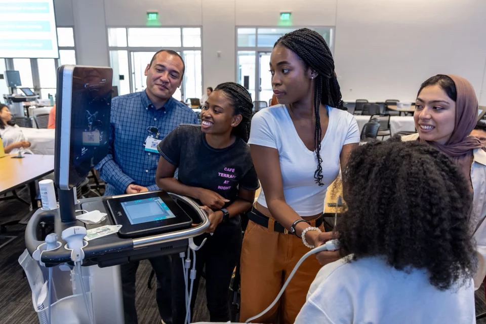 Students looking at monitor during Pocus Intro Course 