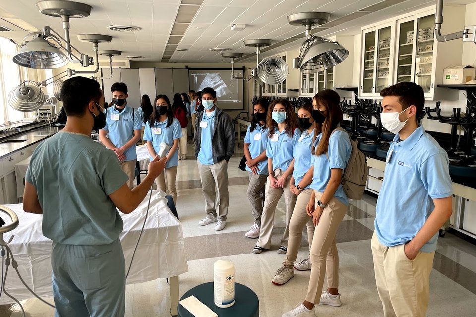 Students from the UCLA Pre-Med Summer Scholars Program gather to see a demonstration. 