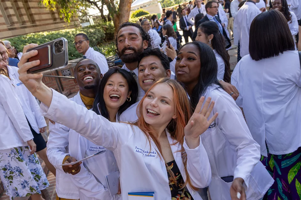 Tereza Vitkovska, pictured with her DGSOM classmates, shares her story of becoming a doctor