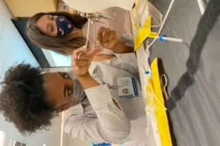 Medical student Shami-Iyabo Mitchell, pictured here doing an OBGYN training exercise, shares her story of becoming a doctor.