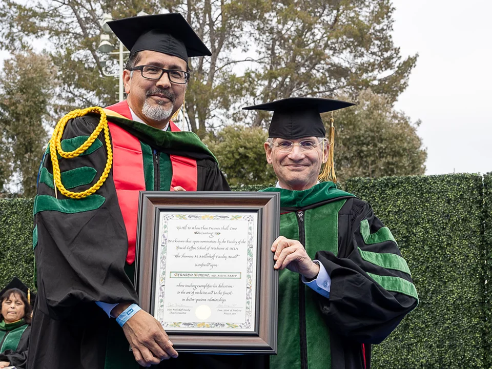 Gerardo Moreno, MD, MSHS, FAAFP receives the Mellinkoff Award at the 2024 Commencement Ceremony at the David Geffen School of Medicine at UCLA.