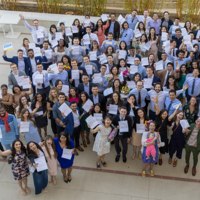Overcoming an Unmatched Medical Residency A large group of students on Match Day holding up their match letters