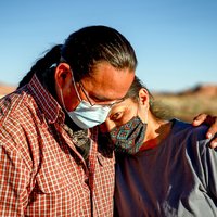 Native American individuals embracing