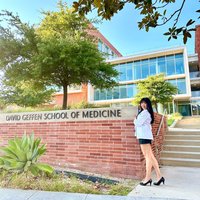 Medical student Joy Xu, pictured in front of the DGSOM sign, shares her story of becoming a doctor. 