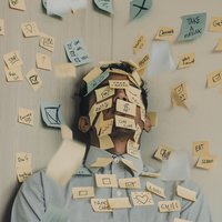 Man covered in post-it notes 