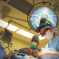 A team of surgeons completing a procedure in the operating room